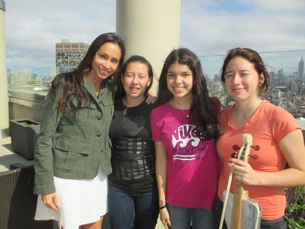 Alejandra Amarilla with Recycled Orchestra members Noelia Ríos, Azucena Azcona and Ada Ríos